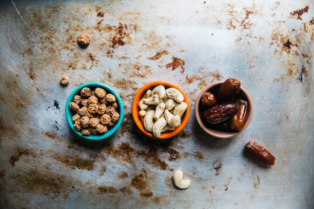 3 bowls  with different nuts on them WellnessBuzz - inspiring health and wellness 