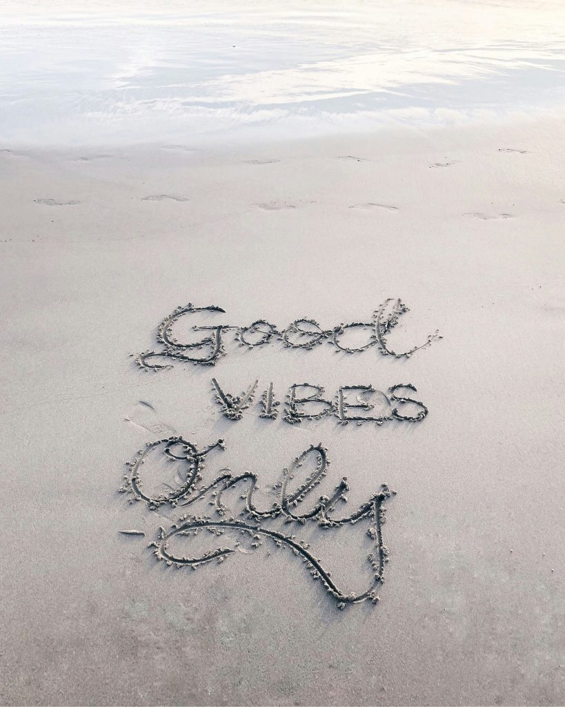 Good Vibes only written in the sand by WellnessBuzz - inspiring health and wellness 